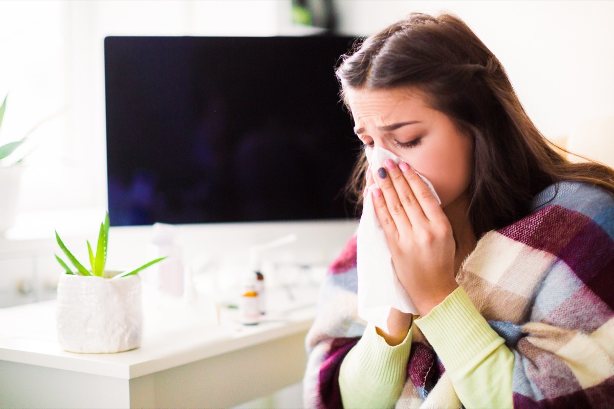 Young Woman Blowing Her Nose