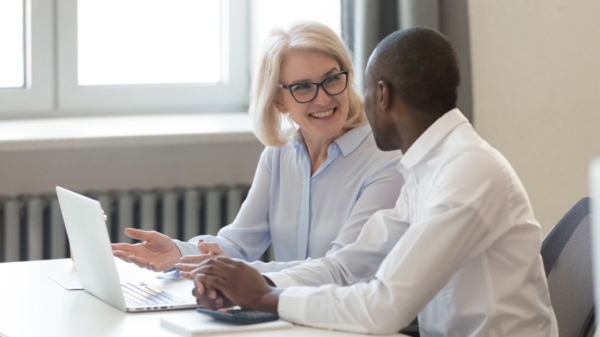 young black man and older white woman at work