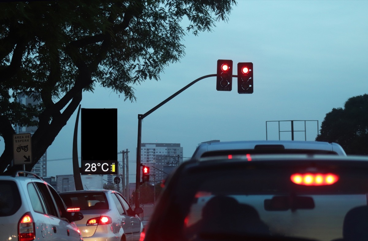 Scenes of traffic jam in the evening in a big city such as S√£o Paulo, with red lights.