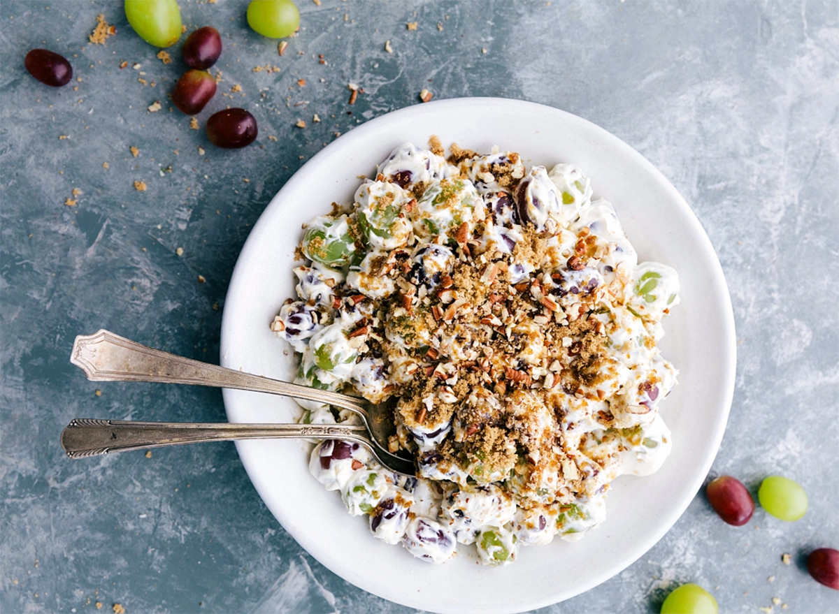 bowl of grape salad with two spoons