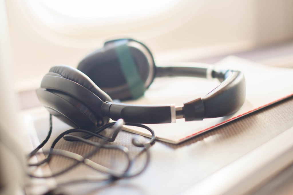 wearing headphones can ensure perfect airplane sleeping airplane sleep tips