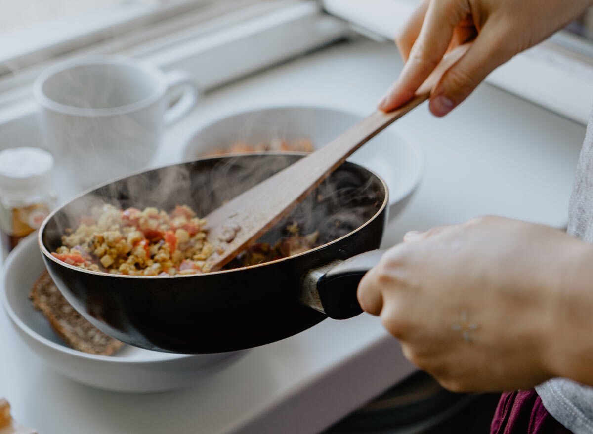 cooking a healthy meal in a skillet