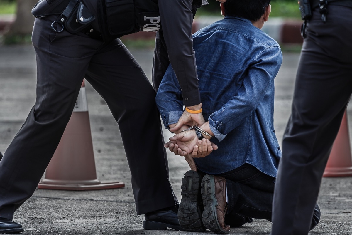 police officers arresting a man, safety tips