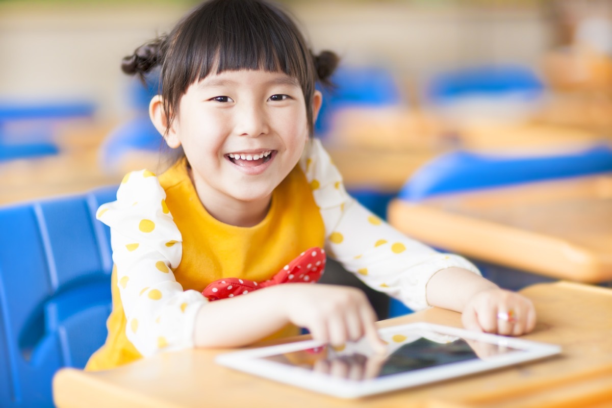 child using ipad at school, worst things about the suburbs