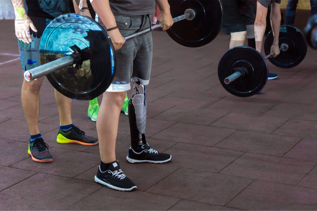 Man with prosthetic leg lifting a barbell