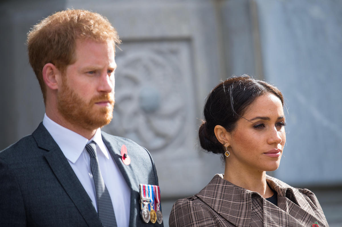 Prince Harry, Duke of Sussex and Meghan, Duchess of Sussex lay ferns and a wreath at the tomb of the Unknown Warrior while they visit the newly unveiled UK war memorial and Pukeahu National War Memorial Park on October 28, 2018, in Wellington, New Zealand.