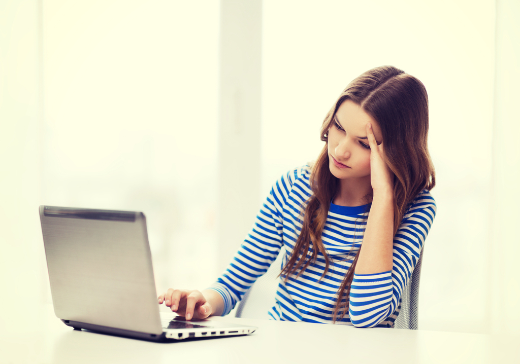 upset woman on computer