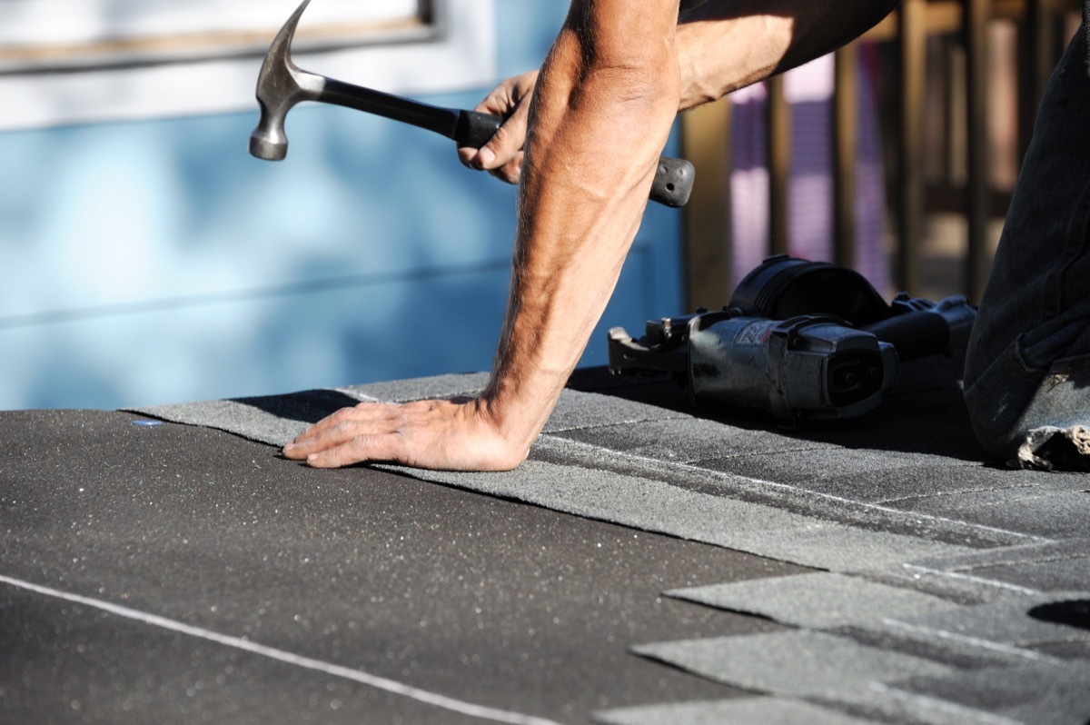 Man Fixing the Roof {Cons of Owning a Big House}