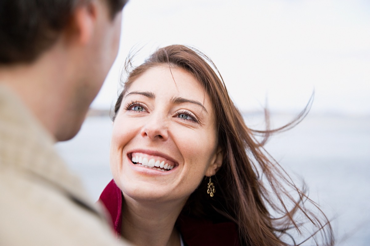 woman smiling looking at her boyfriend