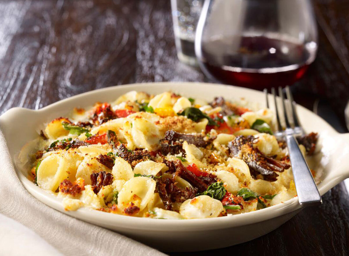 Braised beef pasta with a glass of wine at Maggiano's