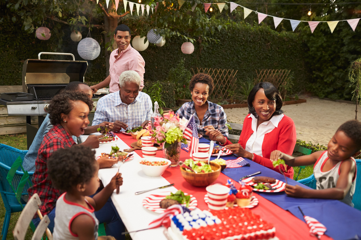 Multi generation family at table for 4th July barbecue