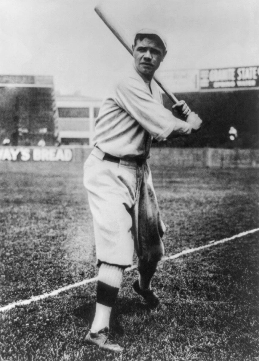 Babe Ruth poses with a bat