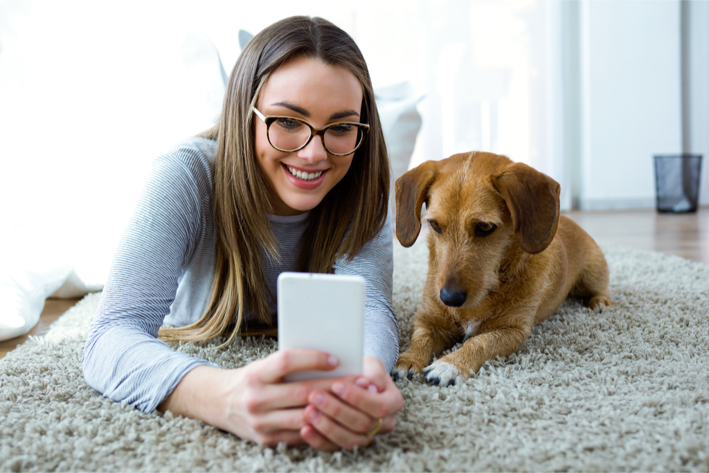 Girl with Dog in Dorm Room