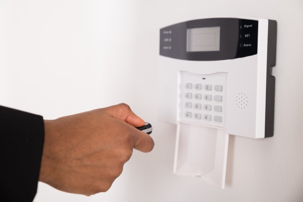 man using security alarm