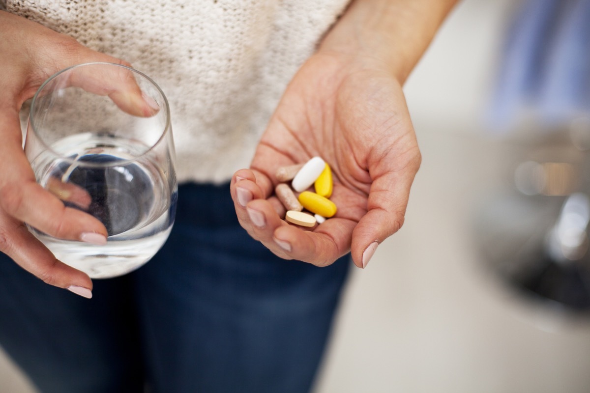 Woman taking vitamins