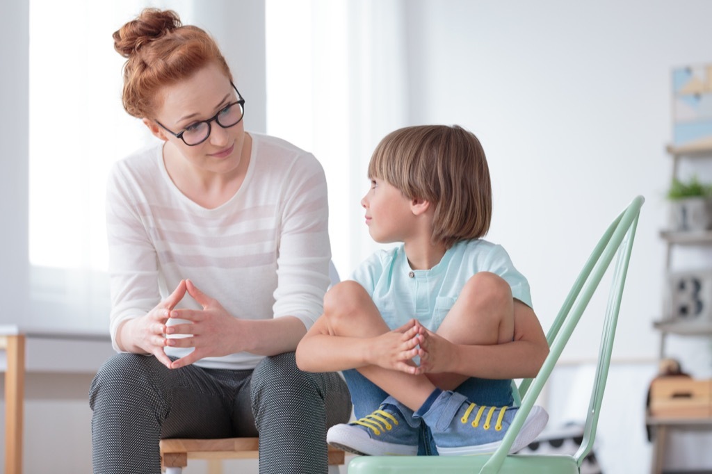 woman talking to young boy being a step-parent