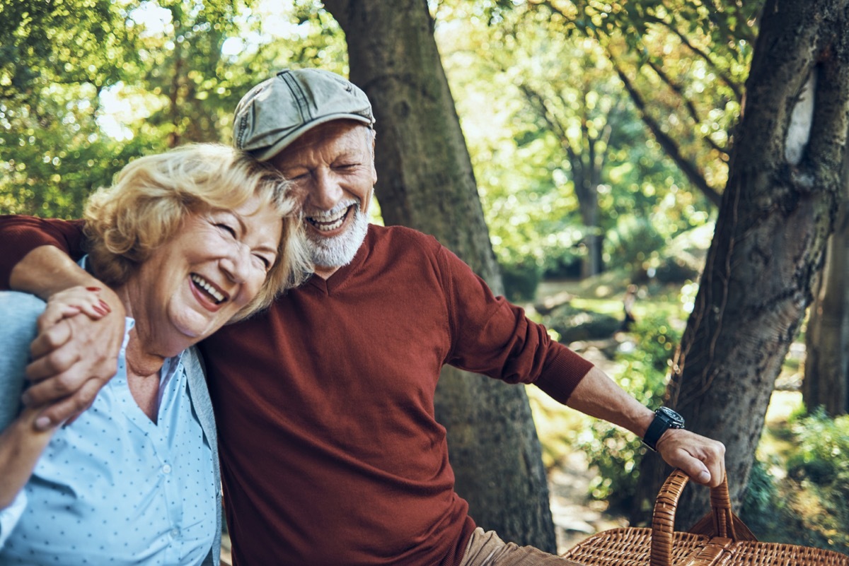 elderly couple laughing and smiling