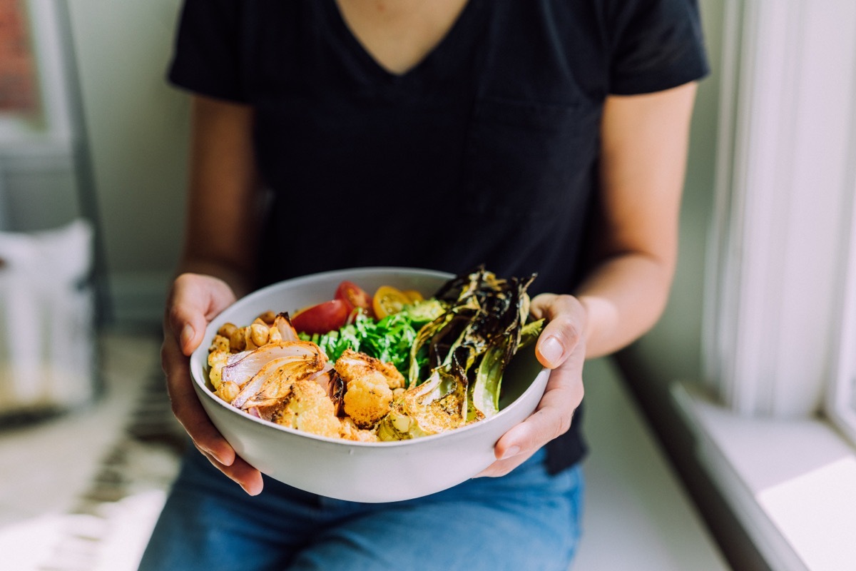 Woman Holding a Bowl of Salad