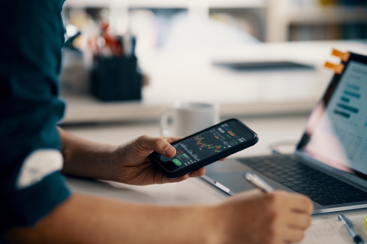 man looking at cryptocurrency on phone