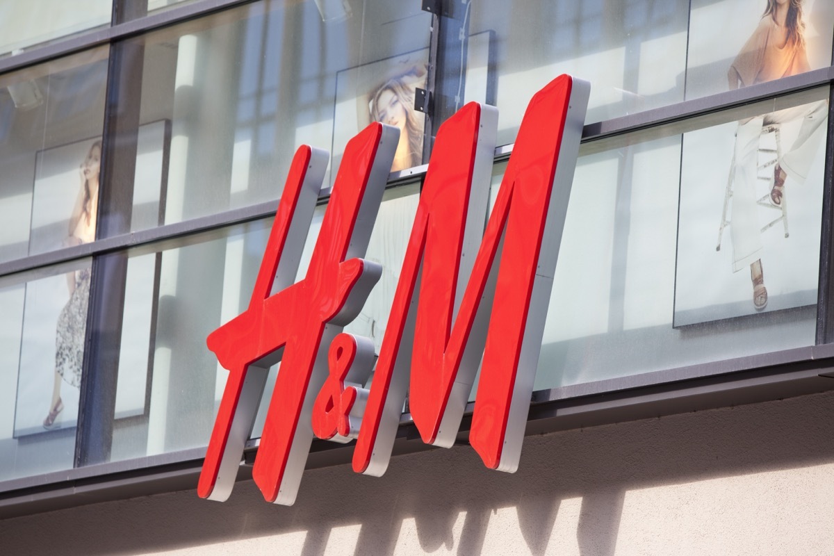 Logo of the Swedish retail-clothing company Hennes & Mauritz (H&M) on a store in the center of Munich (pedestrian area Kaufinger Street).