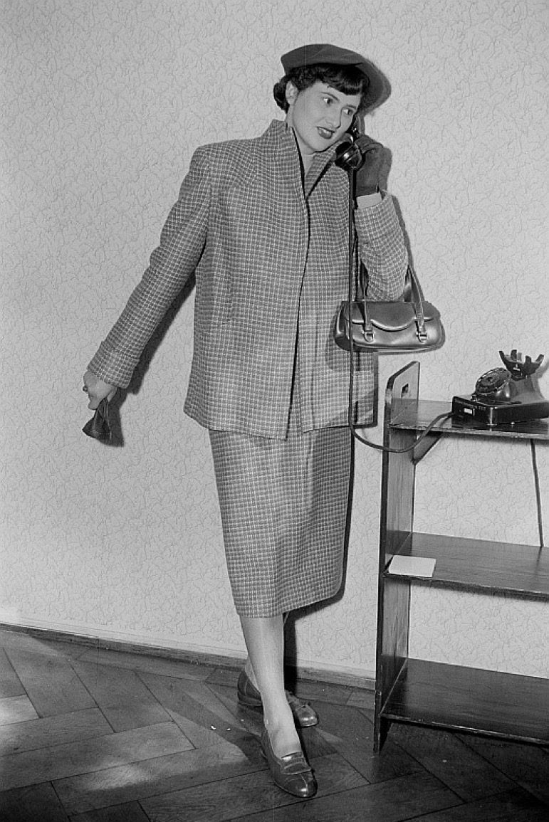 woman calling on rotary phone, 1950s photos