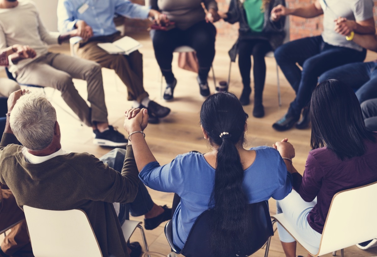 people involved in a support group exercises for mental health