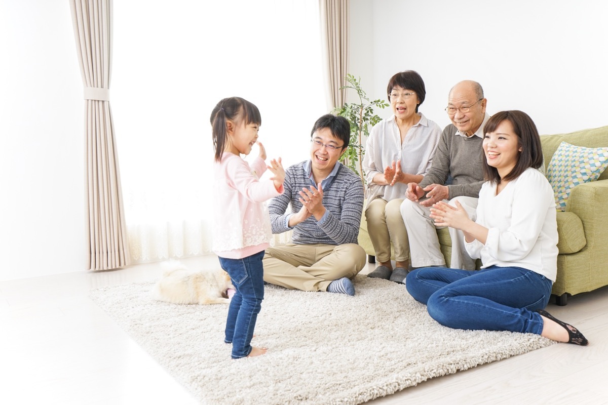 Granddaughter putting on a show for family