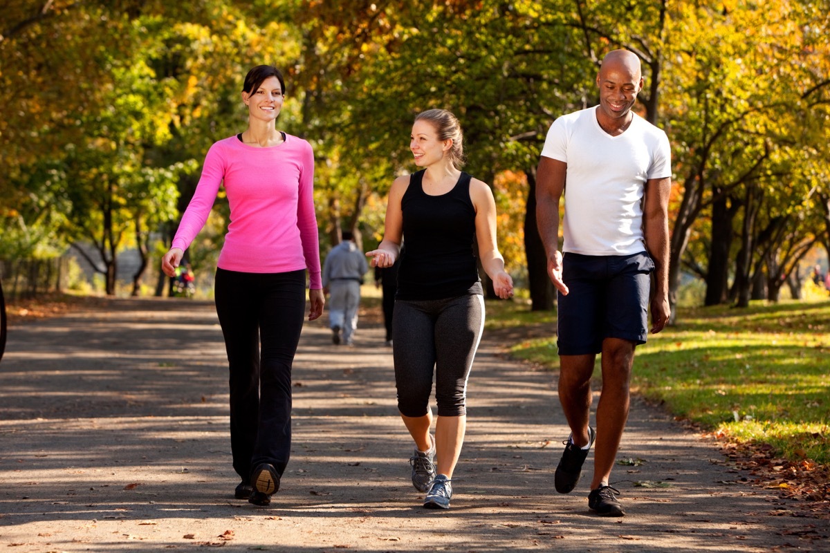 man and women walking for exercise