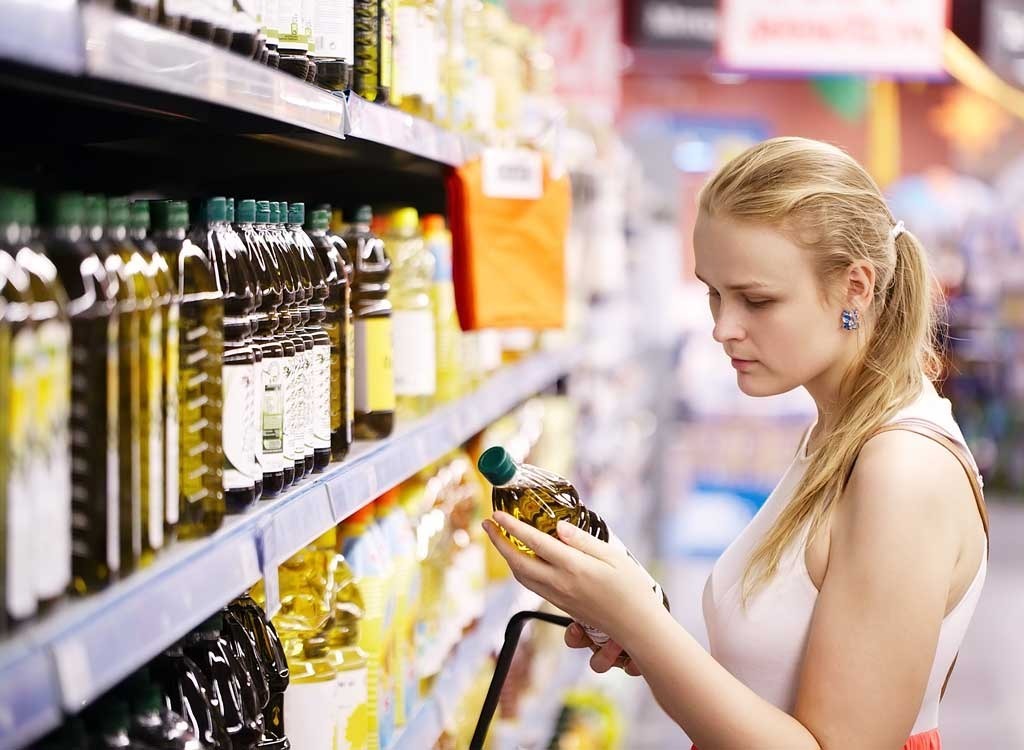 Woman reading olive oil