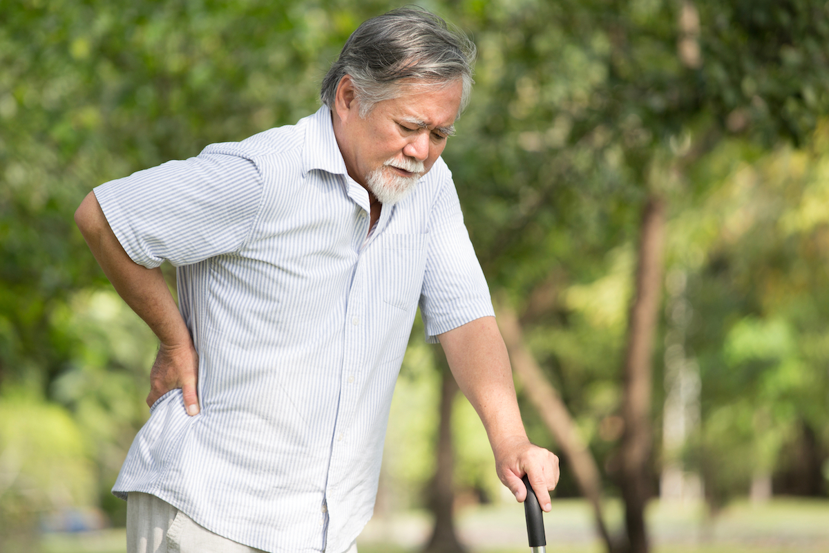 Senior man suffering from back pain