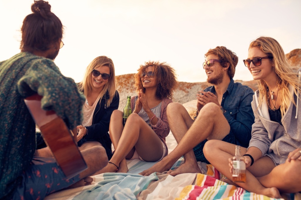 people hanging out on a beach