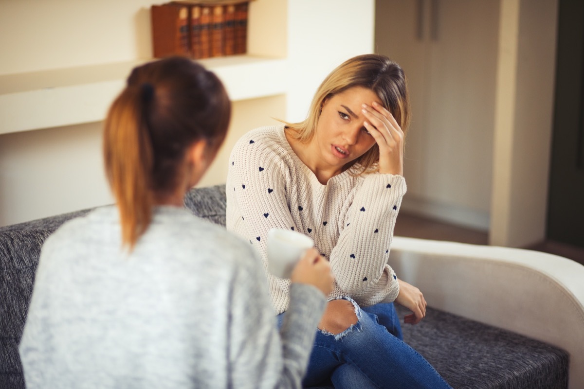 Young woman comforting her friend after bad break up. Rear View.