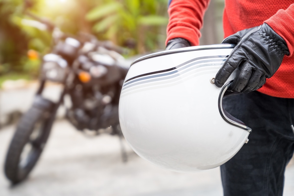 Man Taking off Motorcycle Helmet Alzheimer's Risk